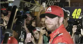  ?? DARRYL GRAHAM — THE ASSOCIATED PRESS FILE ?? In this Nov. 19, 2017, file photo, Dale Earnhardt Jr. is surrounded upon getting out of his car after a NASCAR Cup Series auto race at Homestead-Miami Speedway in Homestead, Fla.