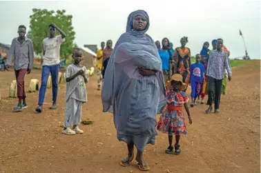  ?? JOAO SILVA/THE NEW YORK TIMES ?? Refugees who have fled the fighting in Sudan are shown Aug. 26 at a processing center in Renk, South Sudan.