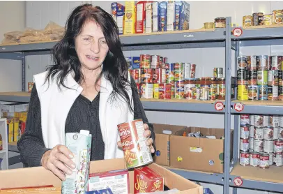  ?? FRAM DINSHAW/TRURO NEWS ?? Darlene Deadder oversees collection of Christmas food packages for food bank clients.