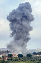  ?? AFP ?? Smoke billows after an Israeli strike on the southern Lebanese border village of Tayr Harfa.