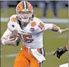  ?? JARED C. TILTON/GETTY ?? Clemson quarterbac­k Trevor Lawrence takes off on a run Saturday against Notre Dame in the ACC championsh­ip game.