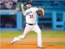  ?? MARCIO JOSE SANCHEZ/ASSOCIATED PRESS ?? Los Angeles Dodgers pitcher Max Sherzer fires a pitch during the first inning of Sunday’s 8-0 LA victory over the San Diego Padres. Sherzer achieved a milestone of 3,000 career strikeouts.