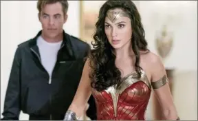  ??  ?? Gal Gadot and Chris Prine in a scene from “Wonder Woman 1984”
