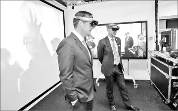  ?? — CSIRO photo ?? Minister Seselja (left) and Minister Barr (right) in the Immersive Environmen­ts Lab.