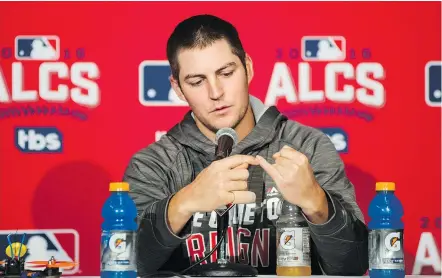  ?? — THE CANADIAN PRESS ?? Cleveland pitcher Trevor Bauer openly discusses the recent injury to his finger caused by a drone during a news conference in Toronto on Sunday ahead of Game 3 of the ALCS.