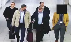  ?? AP ?? In this image released by the Dutch Defence Ministry, yesterday, four Russian military officers are escorted to their flight after being expelled from the Netherland­s in April, for allegedly trying to hack into the UN chemical watchdog OPCW’s network.