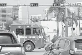  ?? JOHN MCCALL/SUN SENTINEL ?? A Fort Lauderdale Fire Rescue truck makes its way through rush hour traffic on Wednesday. Trains, bridges, constructi­on and traffic slow the fire department's response time.