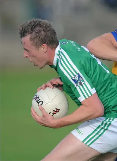  ?? Photos: Ken Finegan ?? Adam Shields, Kilkerley, gets to grips with Geraldines’ star man Jim McEneaney.