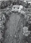  ?? Salvatore Laporta/associated Press ?? A house is left standing on the edge of a lethal landslide in Casamiccio­la, on the southern Italian island of Ischia.