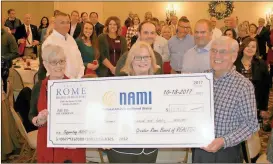  ?? Doug Walker / RN-T ?? Bonnie Moore (from left), Melody Harrison and Jim Moore hold a check from the Greater Rome Board of Realtors to the Rome chapter of the National Alliance on Mental Illness.