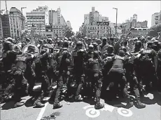  ?? -REUTERS ?? People clash with police during the wake of soccer legend Diego Maradona, in Buenos Aires, Argentina.