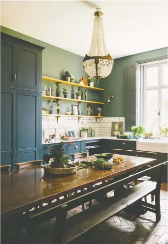  ?? DEVOL ?? A deVOL kitchen in a Victorian rectory features a handmade, copper-topped table as its centrepiec­e.