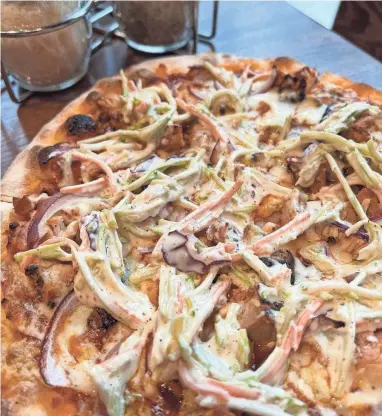  ?? GUSTO PIZZA BAR/SPECIAL TO THE REGISTER ?? The Purdylicio­us pizza at Gusto Pizza Bar launched last year and returned with some revamped ingredient­s for the Super Bowl.