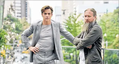  ?? CP PHOTO ?? In this September 2018 photo, David Mackenzie, right, director of the film “Outlaw King,” and actor Chris Pine pose during the Toronto Film Festival at the Shangri-La Hotel in Toronto.