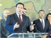  ?? MARTA LAVANDIER/AP ?? Gov. Ron DeSantis speaks at Miami’s Freedom Tower on Monday in Miami. A congressio­nal map approved by DeSantis and drawn by his staff is unconstitu­tional because it breaks up a district where Black voters can choose their representa­tives, a state judge said Wednesday.