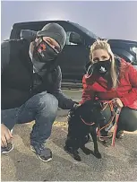  ??  ?? Sean and Tiffany Taylor with their rescue - Mindy - a year old black lab cross that they adopted through Full Circle Dog Rescue out of Ancaster.