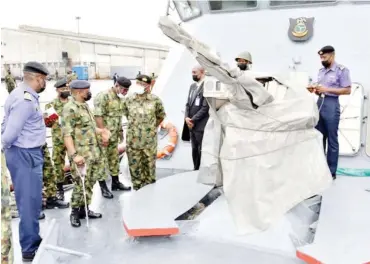  ?? Photo: DINFO NHQ ?? Chief of the Naval Staff, Vice Admiral Awwal Gambo (2nd Left) inspecting the Nigerian Navy Ship ZARIA, during his inspection of ships at NPA wharf, Warri, Delta State yesterday