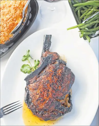  ?? [TIM JOHNSON/ALIVE] ?? The cowboy steak with macaroni and cheese and green beans at Jeff Ruby’s Steakhouse