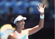  ?? Clive Brunskill / Getty Images ?? Garbine Muguruza thanks the crowd after winning her first-round singles match against Clara Burel during the Australian Open on Tuesday.