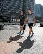  ??  ?? Dane Coles, left, and Codie Taylor return to the All Blacks’ team bus after a training session in Tokyo this week.