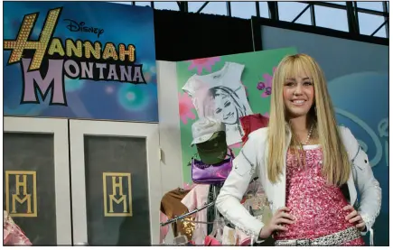  ?? MARY ALTAFFER / AP, FILE ?? Miley Cyrus, star of The Disney Channel’s series “Hannah Montana,” makes an appearance at the Licensing Internatio­nal Expo in New York in 2007. It’s been 12 years since the show that launched Cyrus’ career went off the air, and the stars have continued to find things to do in the meantime.