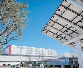  ?? David Butow For The Times ?? WORKER SAFETY has been a sensitive subject for Tesla Chief Executive Elon Musk. Above, a solar panel, right, at Tesla’s car factory in Fremont, Calif., in 2015.