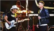  ?? RICK DIAMOND PHOTOS / GETTY IMAGES ?? Brad Paisley and Kane Brown perform at the 51st annual CMA Awards at the Bridgeston­e Arena on Wednesday in Nashville, Tennessee.