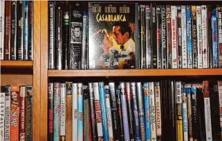  ?? ?? Towle’s movie collection in his home. “I fell in love with San Francisco when I saw ‘Bullitt’ in Chicago,” said Towle, who used to take visitors on a city tour mirroring the famous chase.