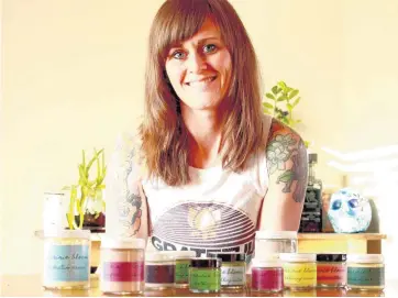  ?? [PHOTO PROVIDED] ?? Jade Arellano, of Norman, is pictured with products she developed for Prairie Bloom, her online store that offers herbal, handcrafte­d skin care products for men, women and children.