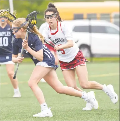  ?? H John Voorhees III / Hearst Connecticu­t Media ?? New Fairfield’s Katelyn Sousa, right, defends Staples’ Ellen Fair during Tuesday’s game at New Fairfield High School.