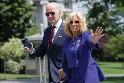  ?? Photograph: Saul Loeb/AFP/Getty Images ?? Joe and Jill Biden return to the White House on 15 May. Financial disclosure reports show the president’s personal finances have changed little in the past year.