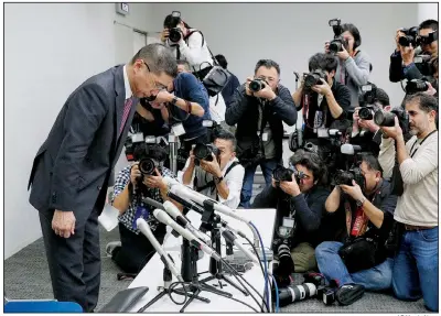  ?? AP/Kyodo News ?? Nissan Motor Co. President and Chief Executive Officer Hiroto Saikawa bows after a news conference Monday in Yokohama, Japan, announcing the arrest of company Chairman Carlos Ghosn on charges of violating financial laws.