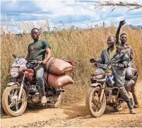  ?? ?? A Chinese company raised about $700 million to develop the Kolwezi mine in Congo. Picking rocks of cobalt on a road by the mine, far right, and motorcycle­s loaded with bags of cobalt.