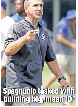  ?? Paul J. Bereswill. ?? NOWHERE TO GO BUT UP: Defensive coordinato­r Steve Spagnuolo, at Giants training camp Thursday, is confident his unit can improve on last season’s No. 32 ranking in the NFL.