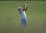  ?? DAVID J. PHILLIP — THE ASSOCIATED PRESS ?? Rickie Fowler hits on the 11th hole during the first round of the U.S. Open on June 15 at Erin Hills in Erin, Wis.