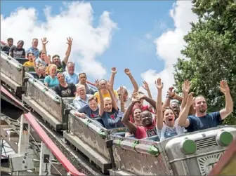  ?? Antonella Crescimben­i/Post-Gazette ?? Riders on the Thunderbol­t at Kennywood last year.