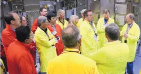 ?? SOURCE: LOS ALAMOS NATIONAL LABORATORY ?? Bob Webster, principle associate director for Los Alamos National Laboratory’s weapons program, talks to a group of community leaders and others on a tour of the lab’s plutonium facility last week.