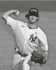  ?? ADAM HUNGER/AP ?? Yankees pitcher Gerrit Cole delivers a pitch during the first inning of a doublehead­er against the Orioles on Friday in New York.