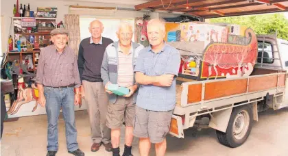  ?? Photo / Dean Taylor ?? Pakeke Lions (from left) Bill Fullerton, Charlie Coles, Ian Grey and Nick Bartosiak preparing the Santa Sleigh Raffle for display and ticket sales.