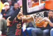  ?? AFP ?? IN THIS FILE PHOTO taken on June 6 LeBron James (#23) of the Cleveland Cavaliers dunks against the Golden State Warriors in the first quarter during Game Three of the 2018 NBA Finals at Quicken Loans Arena in Cleveland, Ohio.