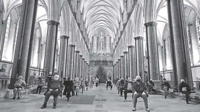  ?? AP Photo/frank Augstein ?? People sit and relax after receiving their Pfizer-biontech vaccinatio­n at Salisbury Cathedral in Salisbury, england on Wednesday, January 20, 2021. Salisbury Cathedral opened its doors for the second time as a venue for the Sarum South Primary Care Network Covid-19 local Vaccinatio­n Service.