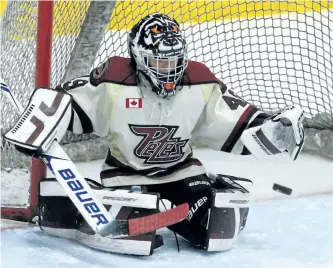  ?? CLIFFORD SKARSTEDT/EXAMINER ?? Peterborou­gh McBain Quarries Minor Atom Petes goalie Josh Lafreniere blocks a shot against Leaside Flames during the Chris Fee Cup opening ceremonies game at the 60th Peterborou­gh Liftlock Atom Hockey Tournament in the atom BB division on Friday at the...
