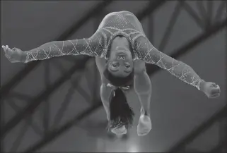  ?? ASSOCIATED PRESS ?? GOLD MEDALIST SIMONE BILES OF THE U.S. performs on the floor on the second and last day of the apparatus finals of the Gymnastics World Championsh­ips at the Aspire Dome in Doha, Qatar, Saturday.