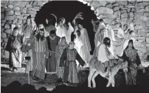  ??  ?? Jesus enters the city on Palm Sunday in a scene from the 2015 “Prince of Peace” Easter Pageant at the Holy City of the Wichitas near Lawton. [THE OKLAHOMAN ARCHIVES]