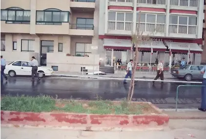  ??  ?? The scene of the assassinat­ion, with Shaqaqi’s body covered in a white sheet on the pavement. Photo: Joe Mifsud Archives