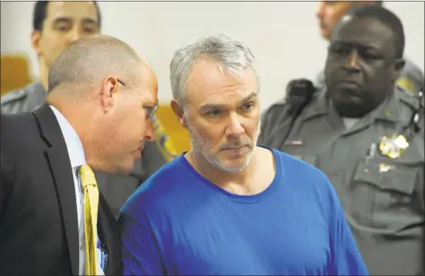  ?? Ned Gerard / Hearst Connecticu­t Media ?? Marc Karun, with attorney Todd Bussert, is arraigned in state Superior Court in Norwalk on Monday. Karun was arrested last week in Maine and is charged with murder with special circumstan­ces and first-degree kidnapping in the 1986 killing of 11-year-old Kathleen Flynn, of Norwalk.