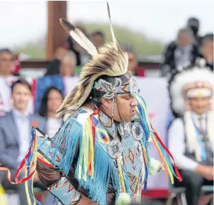  ?? REUTERS ?? A dancer preforms Tuesday for Canada’s Prime Minister Justin Trudeau and other dignitarie­s on Cowessess First Nation, where a search recently found 751 unmarked graves from the former Marieval Indian Residentia­l School near Grayson, Sask.