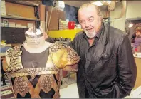  ?? AP PHOTO/DAVID ZALUBOWSKI, FILE ?? In this 2000 file photo, Sir Peter Hall, director of the epic play “Tantalus,” poses with one of the suits of armor being prepared for use in the 10 1/2hour play at the Denver, Colo., Center for the Performing Arts. Hall, founder of the Royal...