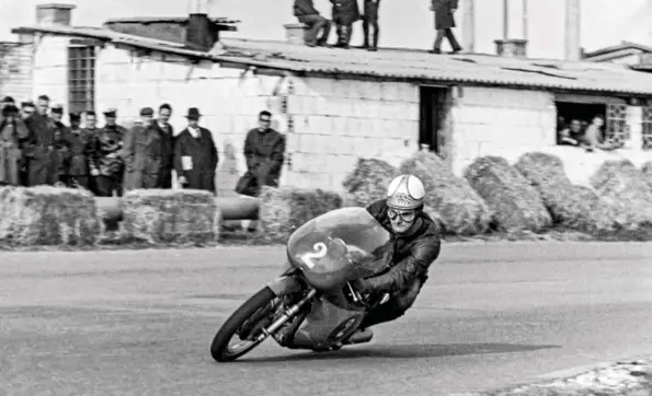  ??  ?? Mike Hailwood, one of a procession of riders who provided the Count with world titles, on an MV 250 at Modena in 1962