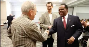  ?? CURT YOUNGBLOOD/THREE RIVERS EDITION ?? Tommy Bond, left, shakes hands with state Rep. Darrin Williams, who is the speaker-designate of the 88th General Assembly of the Arkansas House of Representa­tives. Williams was the guest speaker at the third annual Joint Cabot-jacksonvil­le General...